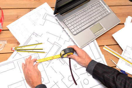 Architect working with blueprintsの写真素材