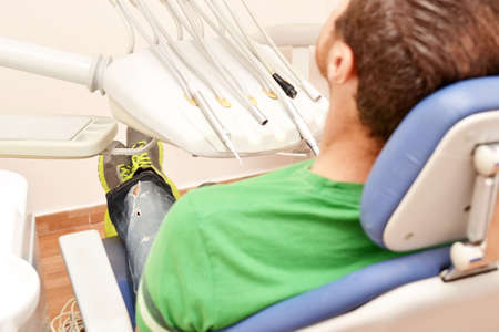 Young man at the dentistの写真素材