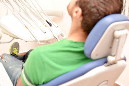 Young man at the dentistの写真素材