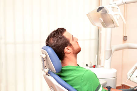 Young man at the dentistの写真素材