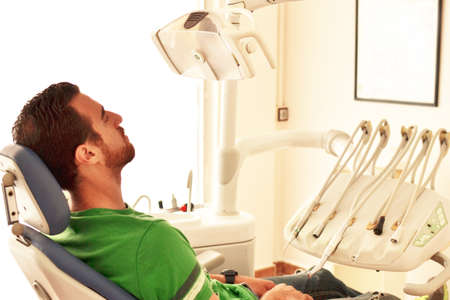 Young man at the dentistの写真素材