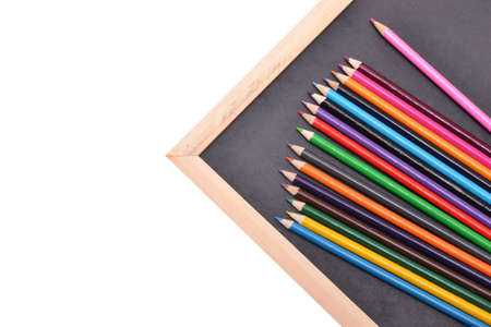 Notebook, colored pencils blackboardの写真素材
