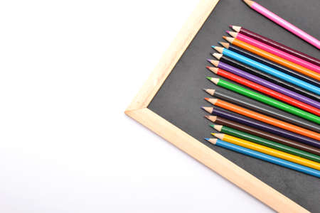 Notebook, colored pencils blackboard