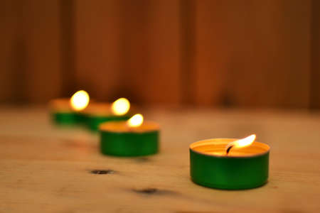 Candles on woodの写真素材