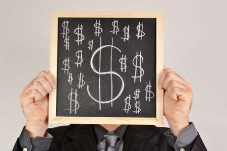 Businessman with dollar blackboardの写真素材
