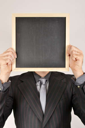 Businessman with blackboardの写真素材