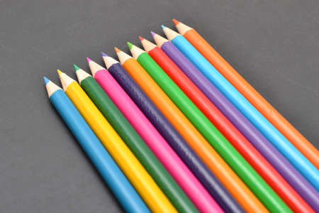 Notebook, colored pencils blackboardの写真素材