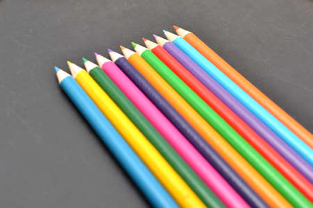 Notebook, colored pencils blackboardの写真素材