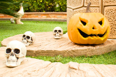 Halloween pumpkin in front of a wellの写真素材