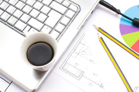 Computer and coffee in the office tableの写真素材