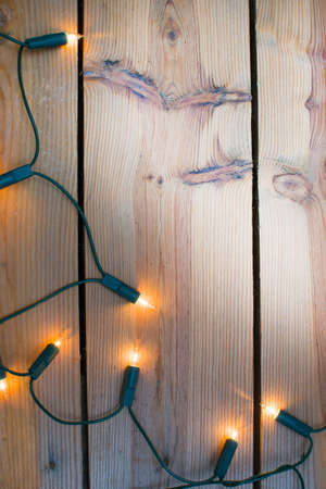Christmas light on woodの写真素材