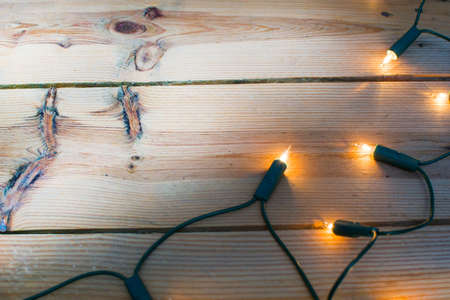 Christmas light on woodの写真素材