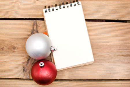 Notebook and Christmas ballsの写真素材