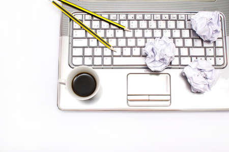 Laptop, coffee and pencil in the officeの写真素材