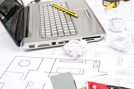 Laptop, pencils and plansの写真素材