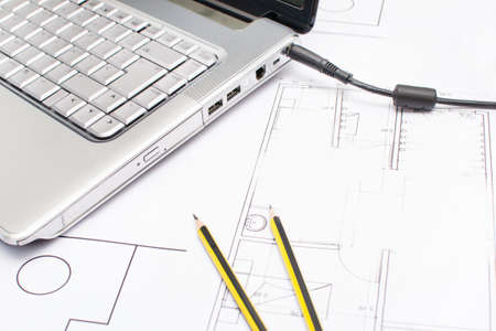 Laptop, pencils and plansの写真素材