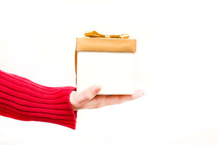 Woman with a gift box in handsの写真素材