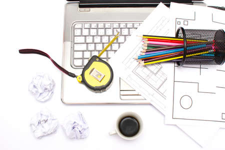 Laptop, meter, pencils and plansの写真素材