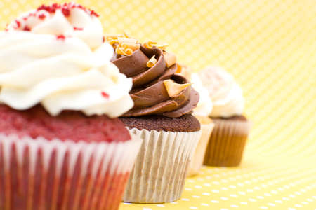 Cupcakes on yellow backgroundの写真素材