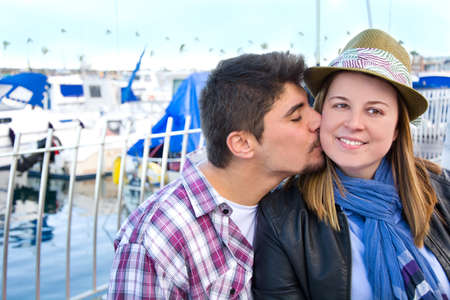 Young woman and young man on a marinaの写真素材