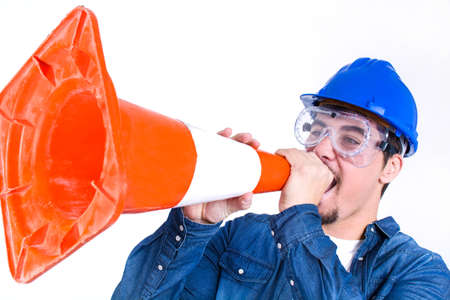 worker shouting with a cone work