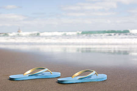 Summer shoes on sandの写真素材