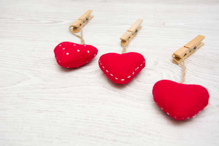 Red hearts on woodの写真素材