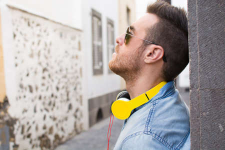 Man listening to music in the streetの写真素材