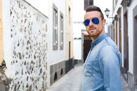 Man walking down the streetの写真素材