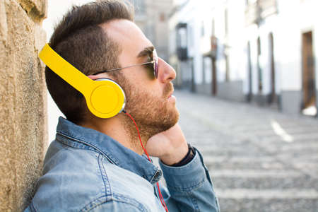 Man listening to music in the streetの写真素材