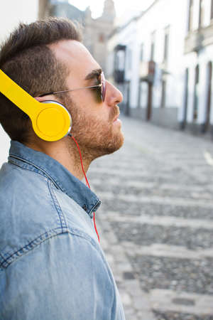Man listening to music in the streetの写真素材