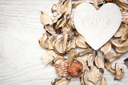Wooden heart with the word love writtenの写真素材