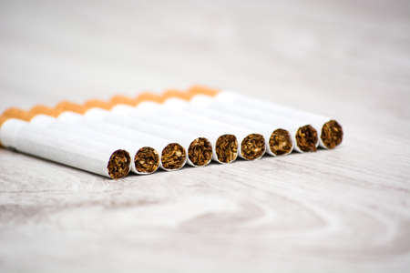 cigarettes on wood tableの写真素材