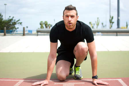man ready to run on the running trackの写真素材