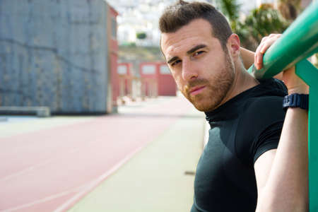 young man sitting after exercise