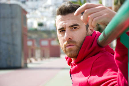 young man sitting after exercise