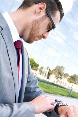 businessman looking at watch