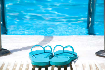 swimming pool and summer shoesの写真素材