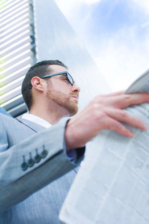 businessman reading newspaper