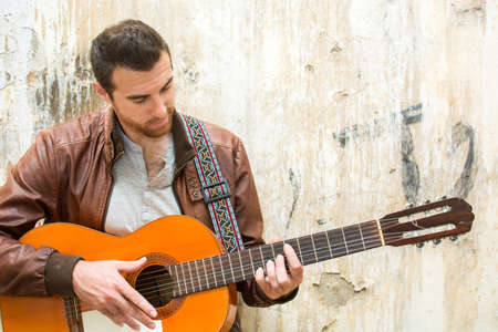 man with guitar. urban style