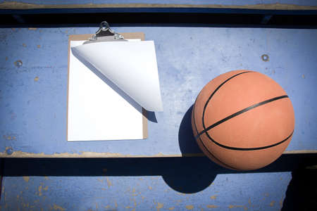 basketball and folder on bleachersの写真素材