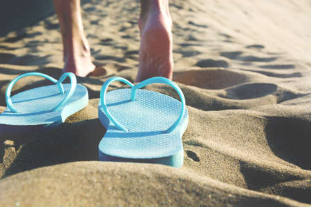 young man walking down a duneの写真素材