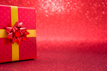 Red gift box with red backgroundの写真素材