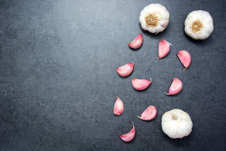 Garlic on slate tableの写真素材