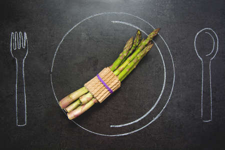 Asparagus on slate tableの写真素材