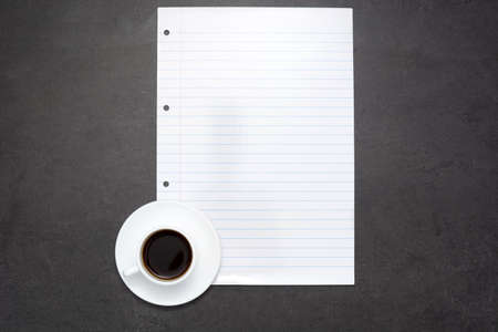 Coffee and sheet of paperの写真素材