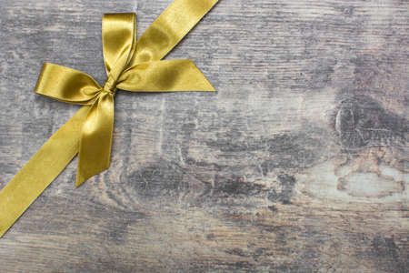 Christmas ribbon on wood backgroundの写真素材