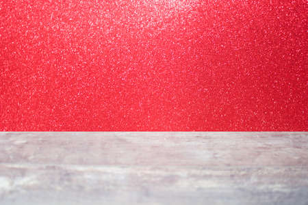 Wood table and red glitterの写真素材