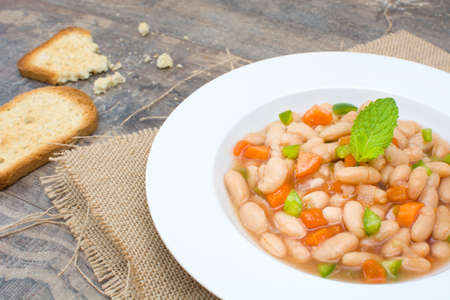 white beans with carrot and green pepperの写真素材