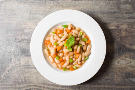 white beans with carrot and green pepperの写真素材
